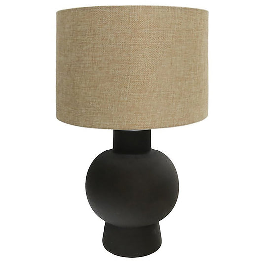 Table lamp with ceramic base in stone finish and natural fabric shade.